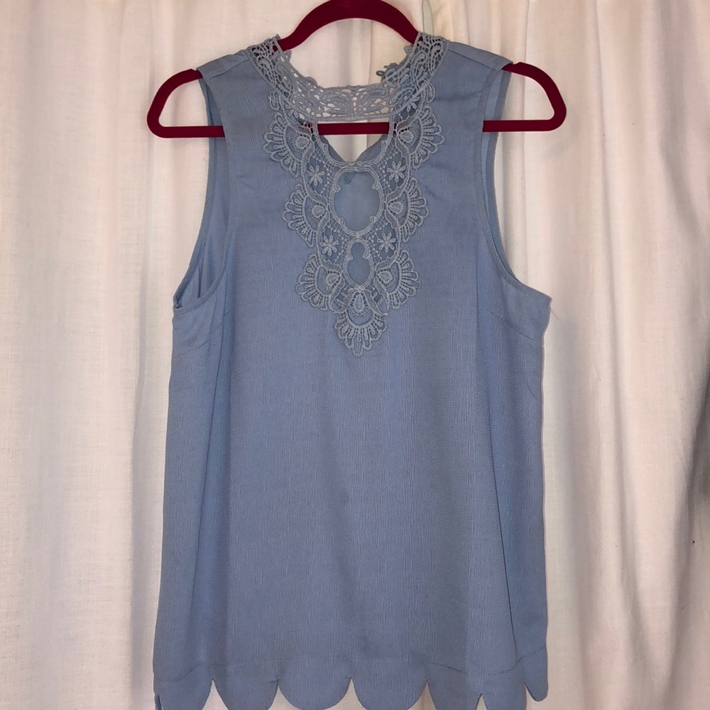 Light blue sleeveless blouse